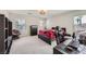 Spacious carpeted bedroom featuring a desk and a view of the outside at 2608 Prospector Mine Ave, North Las Vegas, NV 89031
