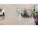 Open dining room with marble floors, sophisticated chandelier, and seamless flow for entertaining at 2608 Prospector Mine Ave, North Las Vegas, NV 89031