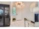 Elegant entryway with marble floors, a mirrored console table, and stylish lighting fixtures at 2608 Prospector Mine Ave, North Las Vegas, NV 89031