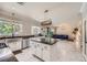 Open kitchen featuring marble floors, stainless steel appliances, a center island, and a view of the living room at 2608 Prospector Mine Ave, North Las Vegas, NV 89031