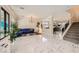 Expansive living area featuring marble floors, stylish decor, and seamless flow between spaces at 2608 Prospector Mine Ave, North Las Vegas, NV 89031