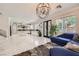 Spacious room with marble floors, modern light fixture and view of the gourmet kitchen at 2608 Prospector Mine Ave, North Las Vegas, NV 89031