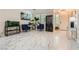 Bright living room with marble floors, comfortable seating, and ample natural light at 2608 Prospector Mine Ave, North Las Vegas, NV 89031