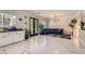 Spacious living area with marble floors, open floor plan, and access to the outdoor area at 2608 Prospector Mine Ave, North Las Vegas, NV 89031