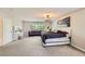 Beautifully designed main bedroom featuring modern decor, plush carpet, and ample space at 2608 Prospector Mine Ave, North Las Vegas, NV 89031