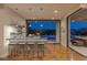 Chic bar area with seating, overlooking the pool and patio, blending indoor and outdoor living at 2610 Eldora Estates Ct, Las Vegas, NV 89117