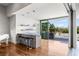 Modern bar area with sleek counter stools and access to the outdoor patio at 2610 Eldora Estates Ct, Las Vegas, NV 89117