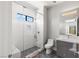Bright bathroom with a glass-enclosed shower, marble bench, and contemporary fixtures at 2610 Eldora Estates Ct, Las Vegas, NV 89117
