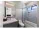 Stylish bathroom with tub and shower combo, and grey tiles at 2610 Eldora Estates Ct, Las Vegas, NV 89117