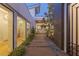 Stylish courtyard with pavers and decorative gravel leading to large windows and doors at 2610 Eldora Estates Ct, Las Vegas, NV 89117