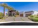 Modern home showcasing a meticulously landscaped front yard and stylish architectural design at 2610 Eldora Estates Ct, Las Vegas, NV 89117