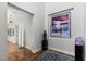 Elegant hallway adorned with modern art and hardwood flooring at 2610 Eldora Estates Ct, Las Vegas, NV 89117