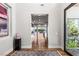 Bright hallway featuring wood floors and views of the home at 2610 Eldora Estates Ct, Las Vegas, NV 89117