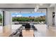 Luxury kitchen with an open view to a covered patio and outdoor living area at 2610 Eldora Estates Ct, Las Vegas, NV 89117