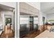 Modern stainless steel refrigerator and wine storage integrated into the kitchen's sleek cabinetry and design at 2610 Eldora Estates Ct, Las Vegas, NV 89117