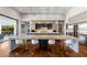 Bright, modern kitchen featuring a large island with seating, stainless steel appliances, and hardwood floors at 2610 Eldora Estates Ct, Las Vegas, NV 89117