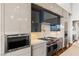 State-of-the-art kitchen with stainless steel appliances, designer cabinetry, and premium countertops at 2610 Eldora Estates Ct, Las Vegas, NV 89117