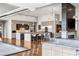 Bright, modern kitchen with dual islands, stainless steel appliances, and hardwood floors at 2610 Eldora Estates Ct, Las Vegas, NV 89117