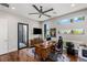 Spacious home office with hardwood floors, contemporary furniture, and a large ceiling fan at 2610 Eldora Estates Ct, Las Vegas, NV 89117