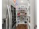 Spacious walk-in pantry with organized shelving and storage solutions at 2610 Eldora Estates Ct, Las Vegas, NV 89117