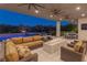Warm and inviting outdoor area with a pool, spa, fire feature, and comfortable lounge seating at 2610 Eldora Estates Ct, Las Vegas, NV 89117