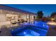 Stunning outdoor area with a pool, spa, fire features, and access to both the patio and home at 2610 Eldora Estates Ct, Las Vegas, NV 89117