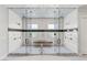 Large walk-in shower with dual shower heads, a built-in bench, and glass surround at 2610 Eldora Estates Ct, Las Vegas, NV 89117