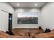 Comfortable theater room with a large screen, surround sound, and plush leather seating at 2610 Eldora Estates Ct, Las Vegas, NV 89117