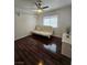 Cozy bedroom with hardwood floors, a ceiling fan, and a bright window, perfect for a serene retreat at 2913 Domino Way, Las Vegas, NV 89117