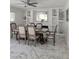 Elegant dining room with marble floors and a view of built-in shelving, featuring a large mirror above the fireplace at 2913 Domino Way, Las Vegas, NV 89117