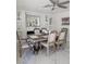 Well-lit dining room with a decorative table, marble floors, and recessed lighting, adjacent to built-in shelving at 2913 Domino Way, Las Vegas, NV 89117