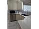 Bright modern kitchen with white cabinets, granite counters, and marble tile flooring at 2913 Domino Way, Las Vegas, NV 89117