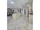 Bright kitchen featuring marble tile flooring, a large island, and stainless steel appliances at 2913 Domino Way, Las Vegas, NV 89117