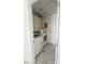 Efficient laundry room featuring modern appliances, upper cabinets, and stylish tile flooring for easy maintenance at 2913 Domino Way, Las Vegas, NV 89117
