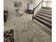 Spacious living room featuring marble tile flooring, modern decor, and a staircase at 2913 Domino Way, Las Vegas, NV 89117
