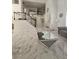 Open concept living room with marble flooring, stairs, and lots of natural light at 2913 Domino Way, Las Vegas, NV 89117