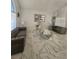 Bright living room with large windows, marble tile flooring, and stylish decor at 2913 Domino Way, Las Vegas, NV 89117