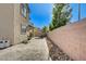 Home's backyard featuring a concrete patio and perimeter boundary wall at 3002 Coveri Ct, Las Vegas, NV 89141