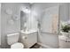 Charming bathroom featuring a vanity with mirror, toilet, and decorative wall art at 3002 Coveri Ct, Las Vegas, NV 89141