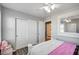 Bedroom view features a closet, mirror, neutral walls and ceiling fan at 3002 Coveri Ct, Las Vegas, NV 89141