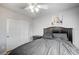 Comfortable bedroom featuring wood-look floors, a ceiling fan, and a double-door closet at 3002 Coveri Ct, Las Vegas, NV 89141