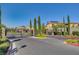 Gated community entrance featuring meticulous landscaping and wrought iron gates at 3002 Coveri Ct, Las Vegas, NV 89141
