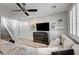 Spacious living room with a plush sofa, and decorative shelves, creating a relaxing atmosphere at 3002 Coveri Ct, Las Vegas, NV 89141