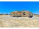 Rear exterior with desert landscaping at 3016 Mount Charleston Dr, Pahrump, NV 89048