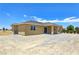 Rear exterior featuring desert landscaping and stucco at 3016 Mount Charleston Dr, Pahrump, NV 89048