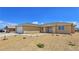 Beautiful single story home featuring manicured front yard and neutral colored exterior at 3016 Mount Charleston Dr, Pahrump, NV 89048