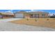 Charming single story home showcasing well kept front yard and two car garage at 3016 Mount Charleston Dr, Pahrump, NV 89048