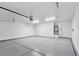 Expansive two-car garage with epoxy flooring and rear entry door at 3016 Mount Charleston Dr, Pahrump, NV 89048