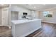 Open kitchen with an island, white cabinets, and stainless steel appliances at 3016 Mount Charleston Dr, Pahrump, NV 89048