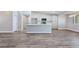 Bright, open-concept kitchen with an island, white cabinets, and stainless steel appliances at 3016 Mount Charleston Dr, Pahrump, NV 89048